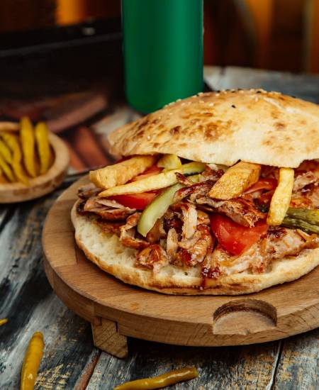 chicken doner with tomato french fries and pickled cucumber chicken doner with tomato french fries and pickled cucumber