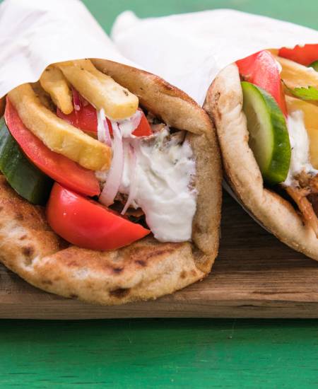 Greek chicken souvlaki ona pita with fresh vegetables with tzatziki sauce